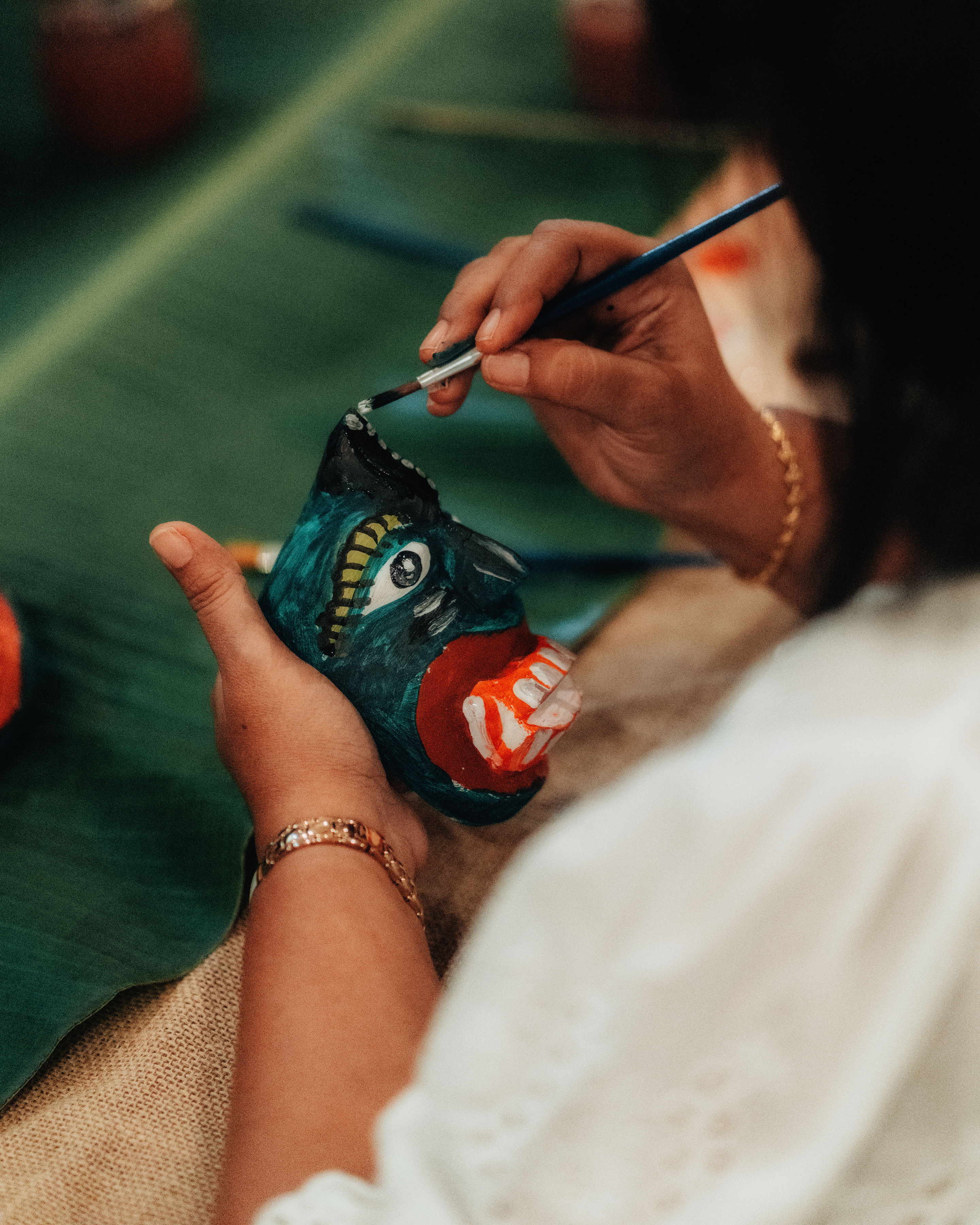 a group of women standing on top of a sandy beach