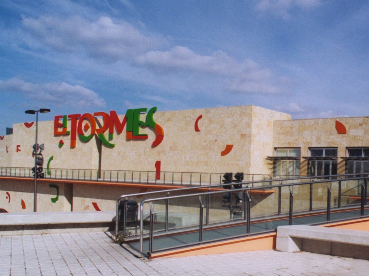 Rooftops of a coastal town with the sea in background