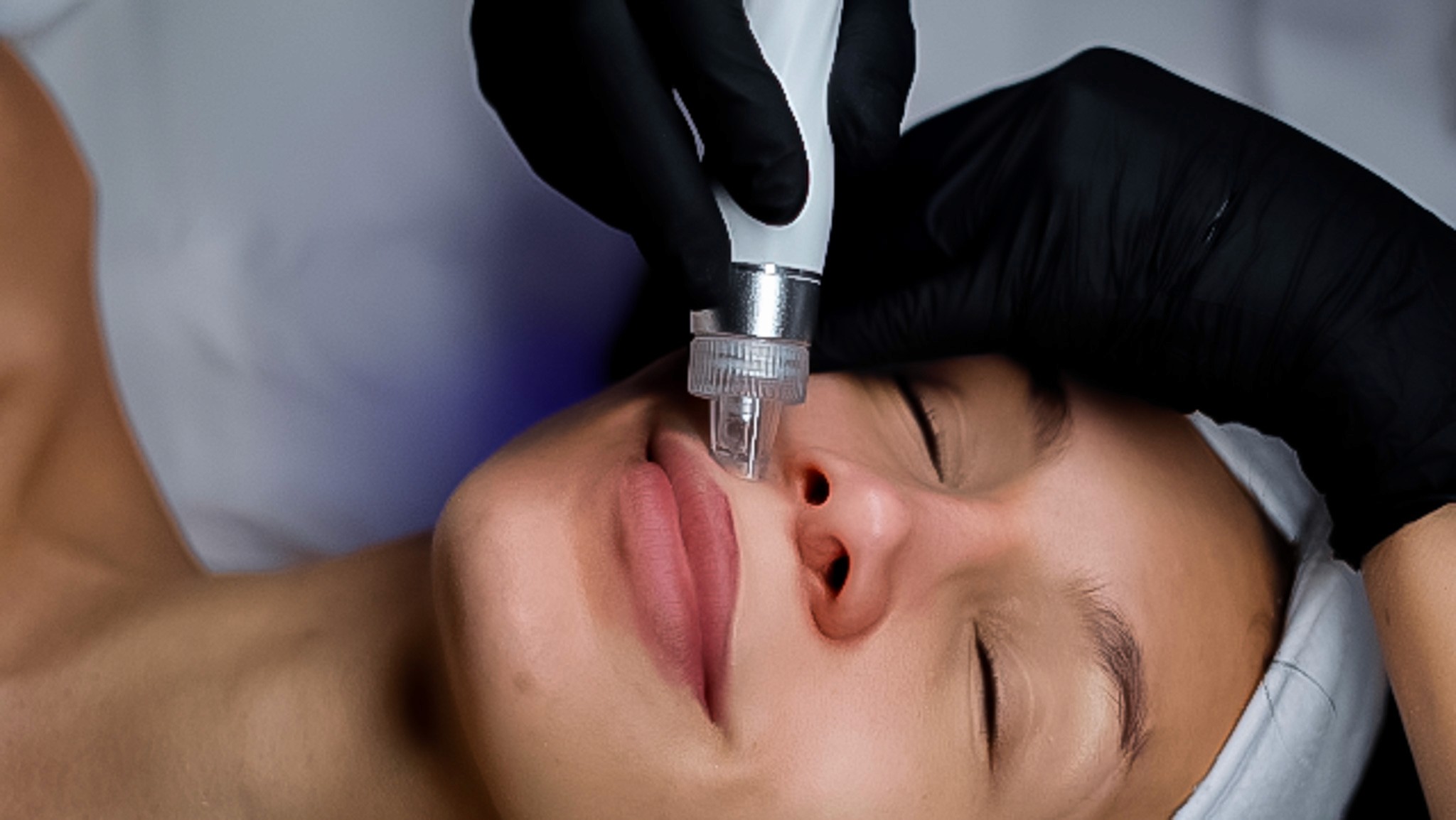 Portrait of a woman with long red hair gently touching her face, looking into the camera