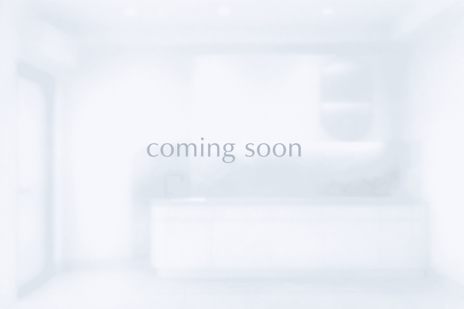 a purple chair sitting in a room next to a desk