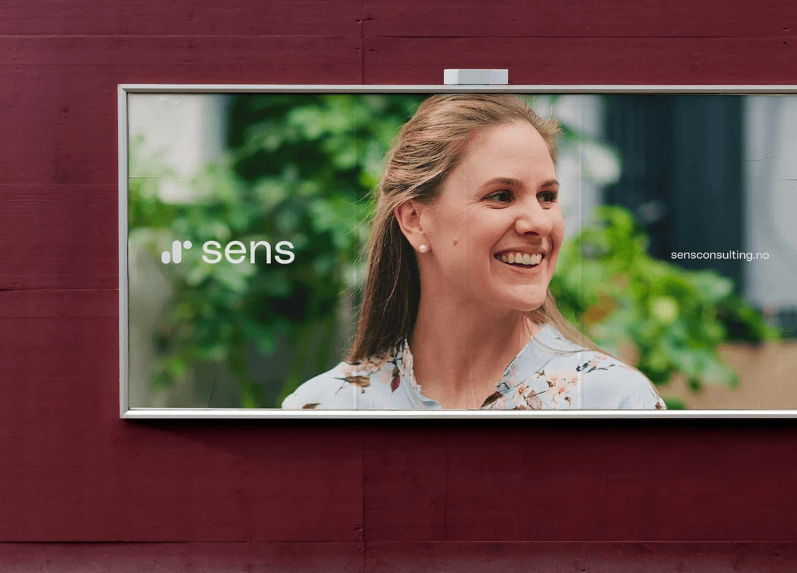 Billboard design featuring the logo design for Sens Consulting firm and a smiling female consultant.