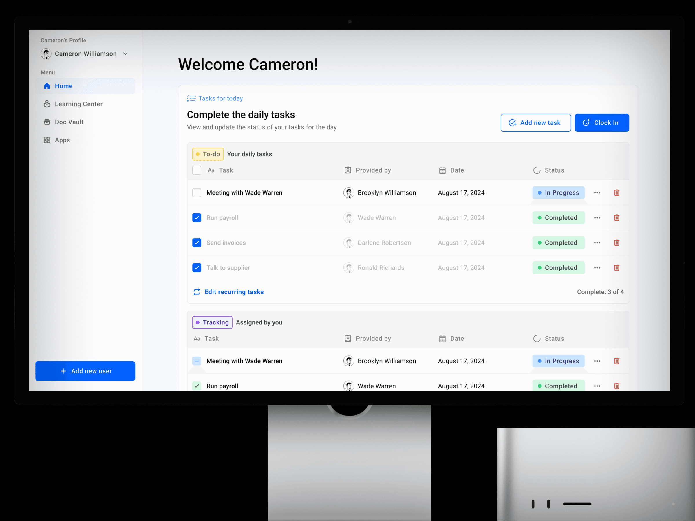 На экране компьютера отображается интерфейс управления задачами. Он приветствует пользователя по имени Кэмерон и показывает задачи со статусами «В процессе» и «Завершено». На боковой панели расположены такие пункты, как «Главная» и «Учебный центр».