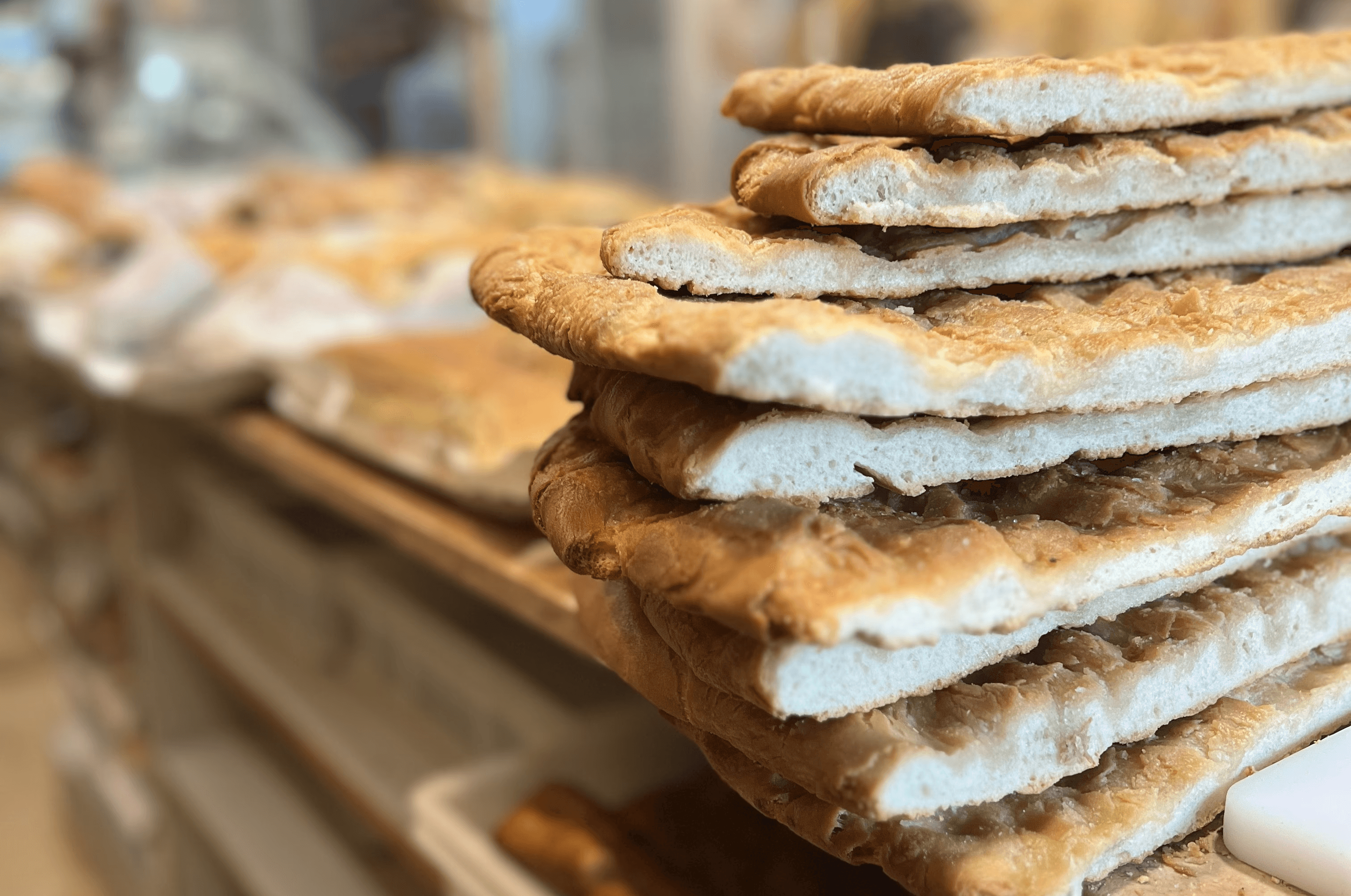 assorted bread in wicker baskets