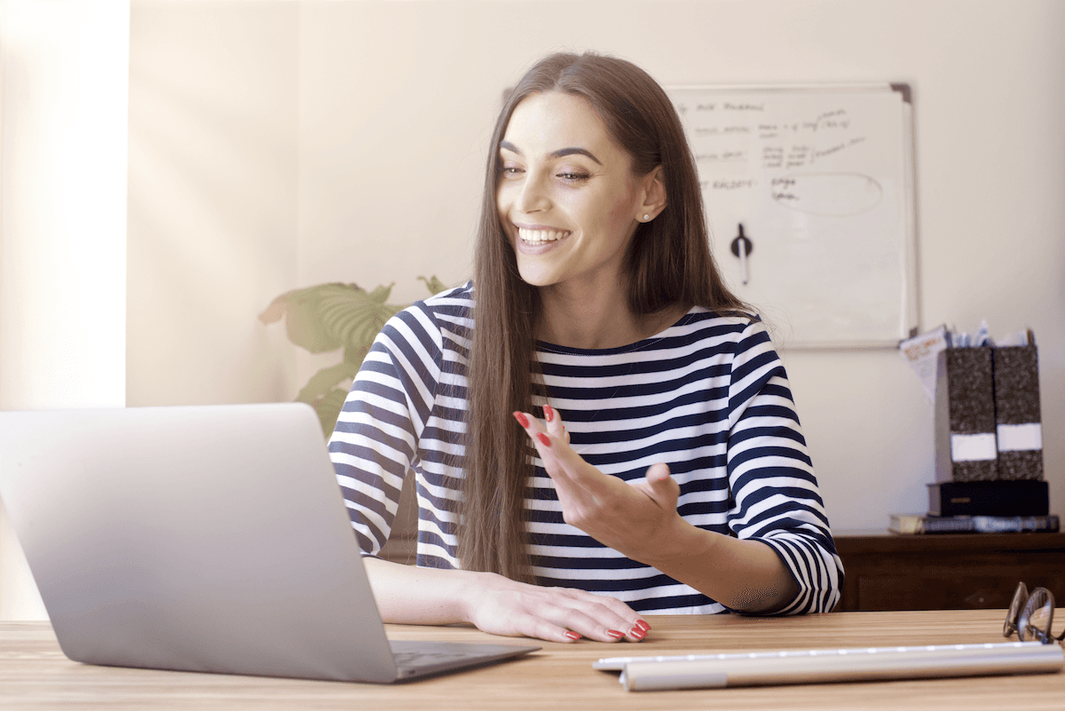 consultative selling: woman having a video call using her laptop