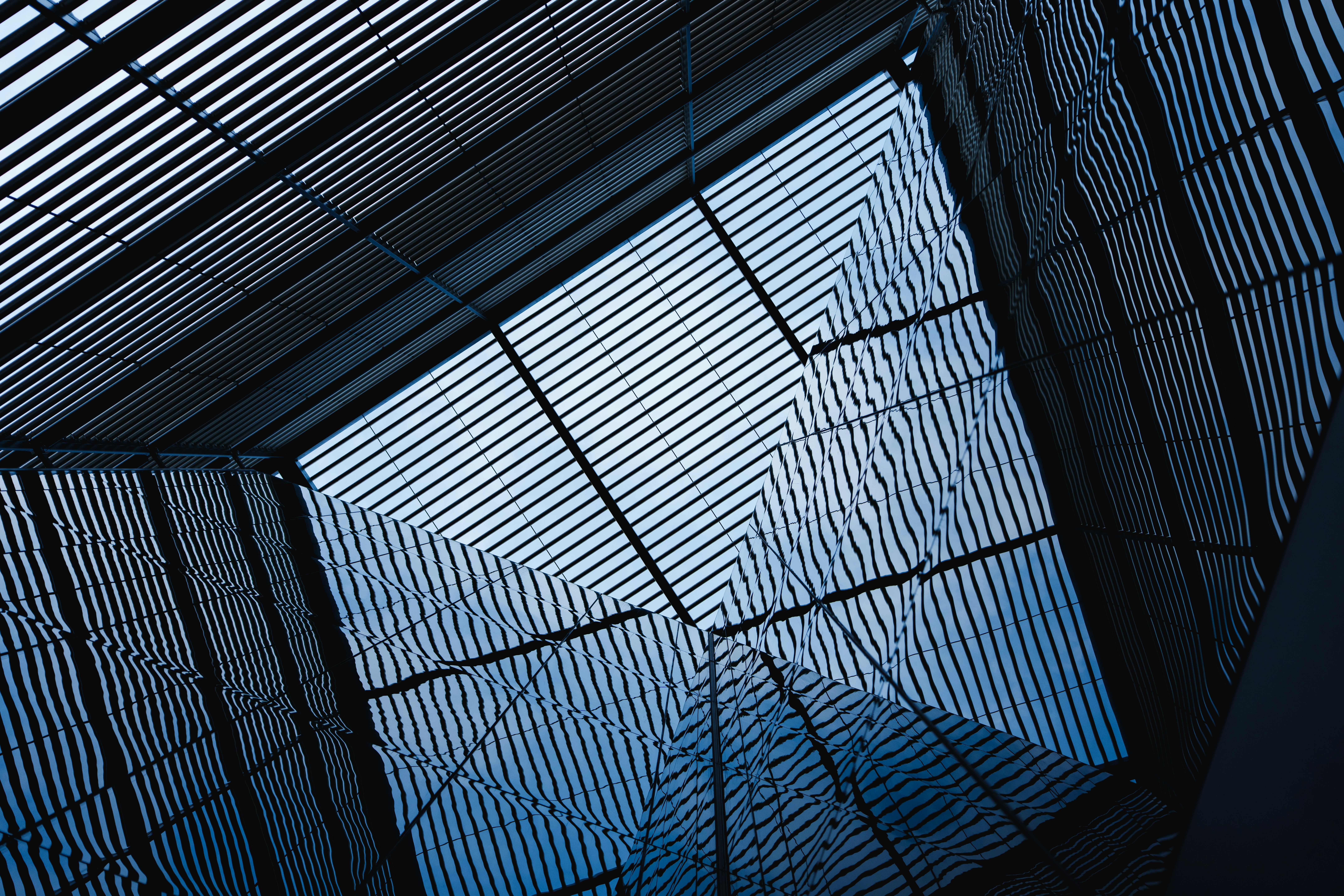 Modern building with geometric patterns and blue sky