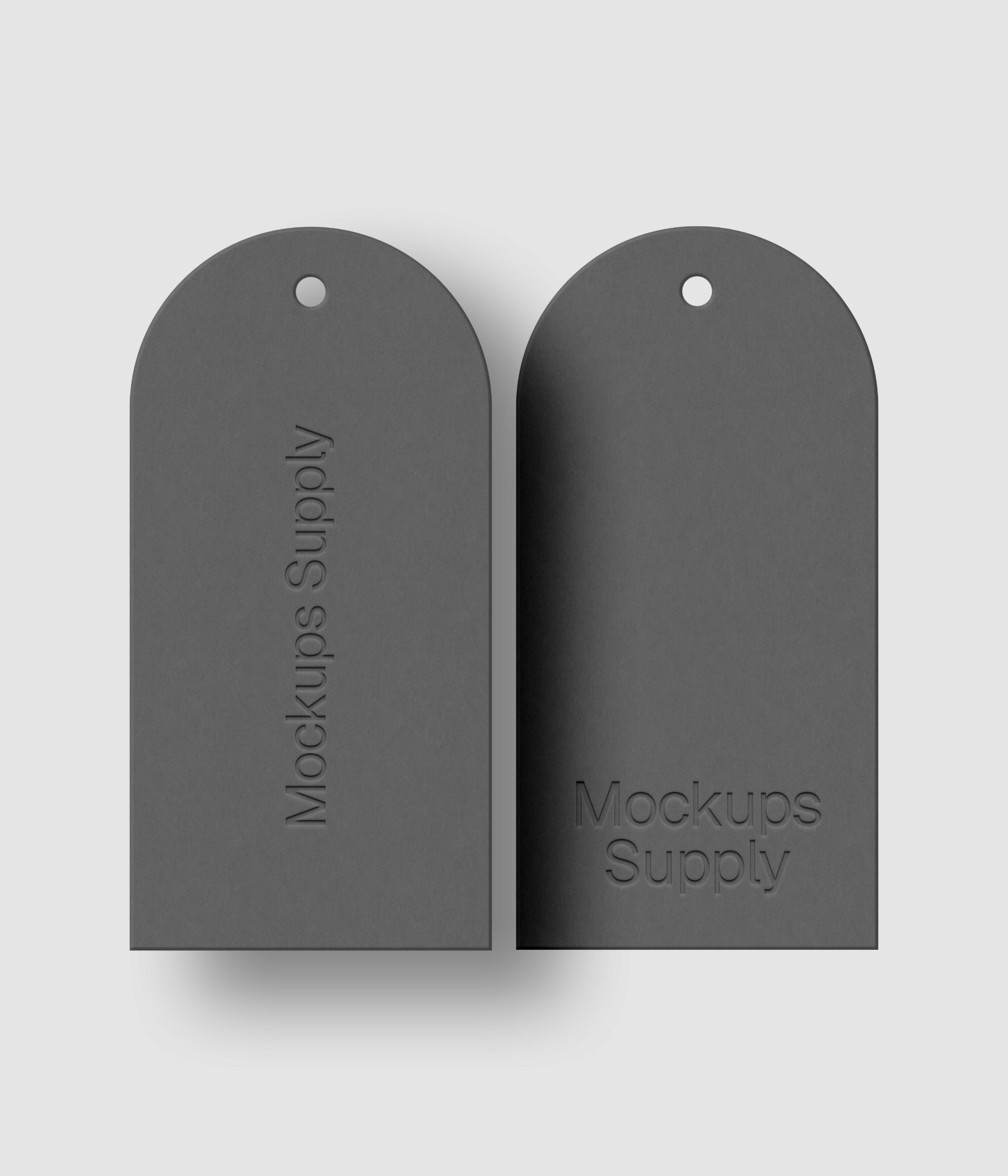Pair of white arched top tags featuring letterpress pressed logo with customizable shadow and colors for clean branding presentation
