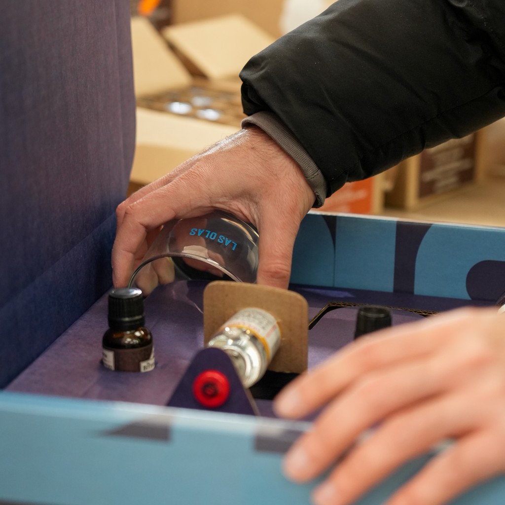 Worker putting a product into its box