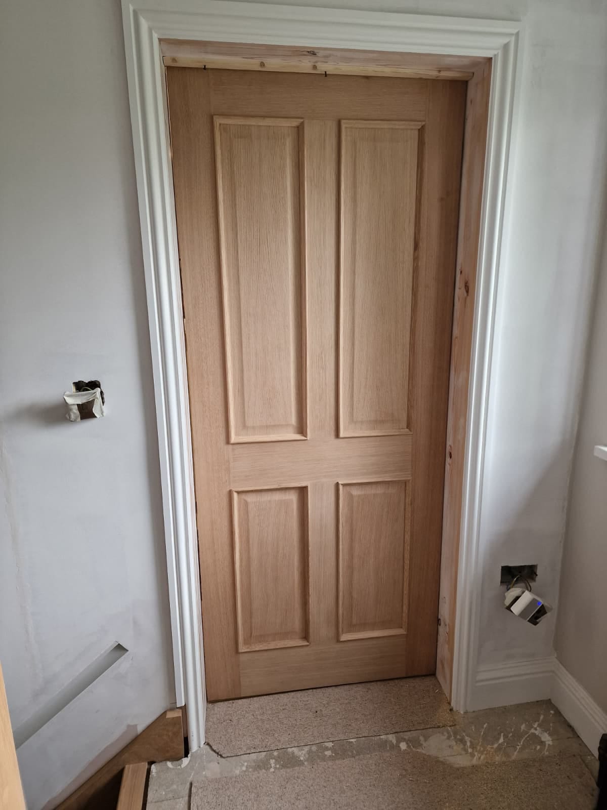 Oak doors through a hallway