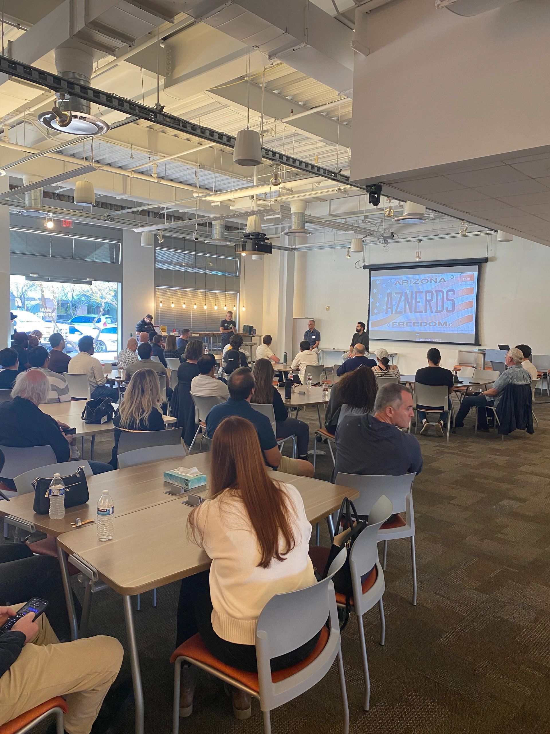 a black and white living room with a large tv
