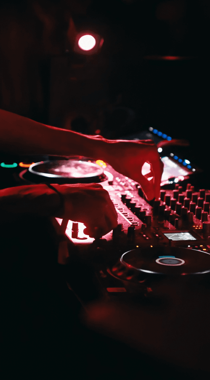 Woman in black outfit sitting on floor