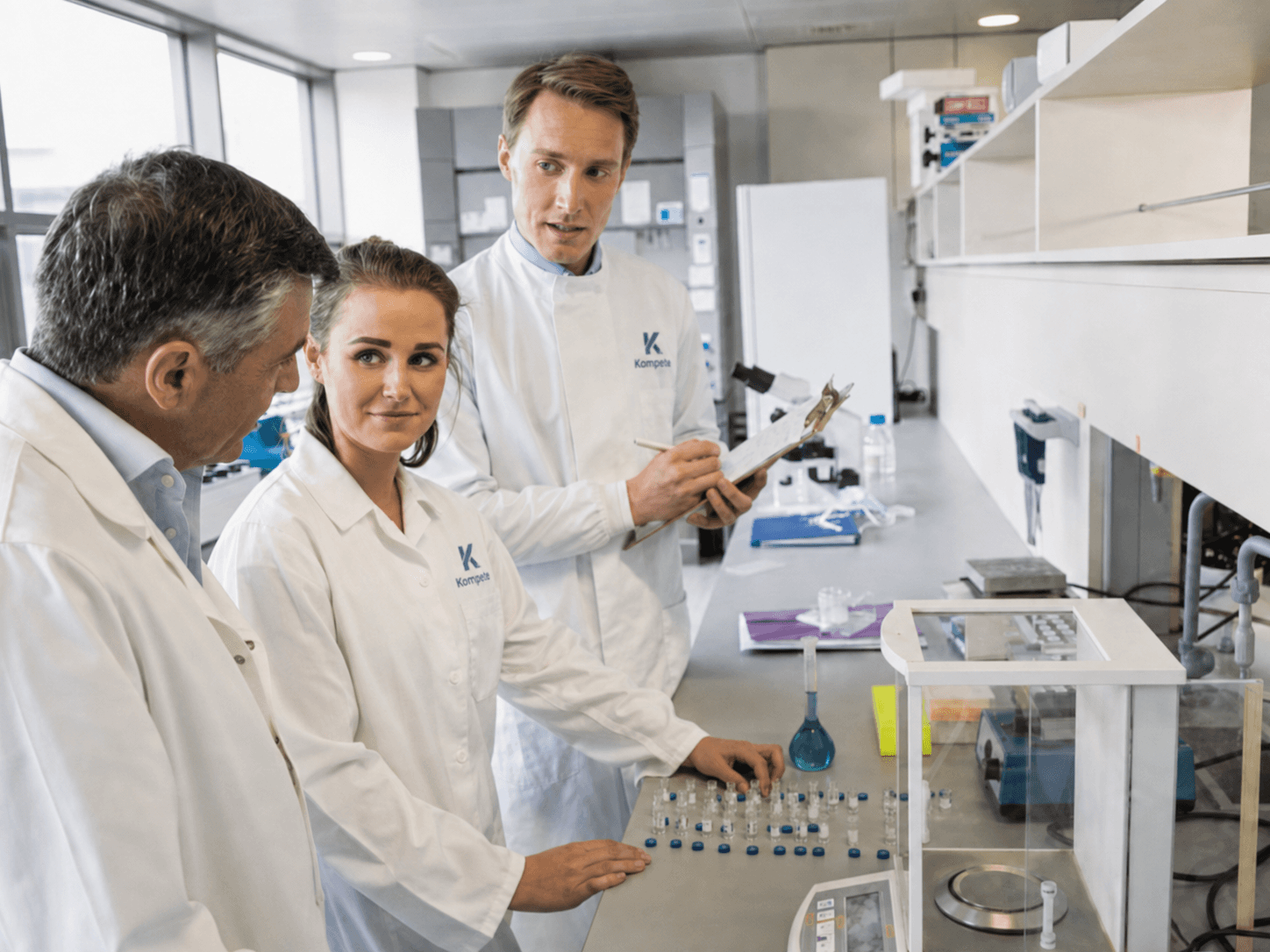 Kompete laboratory scientists collaborating on formulation development