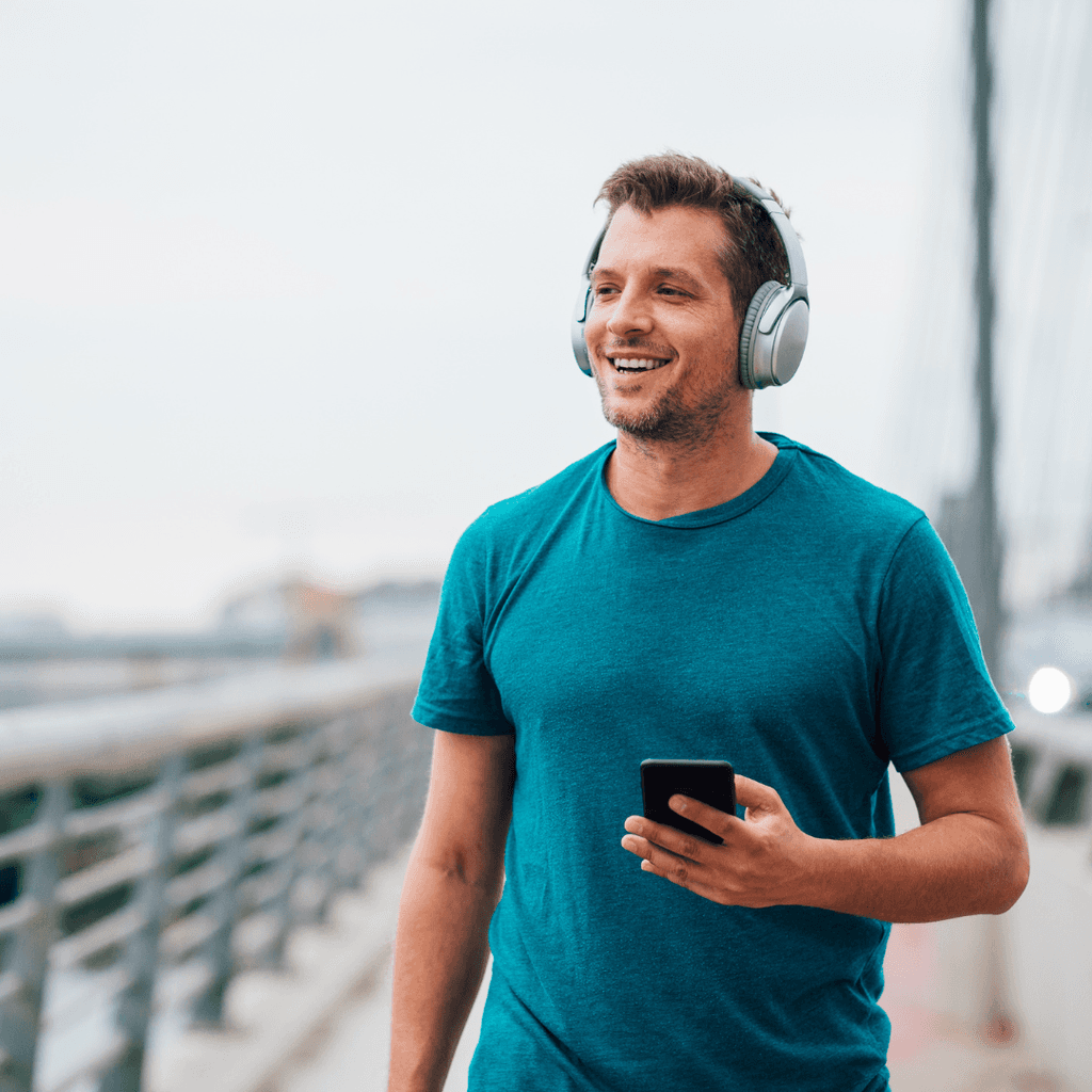 Man jogging across a bridge