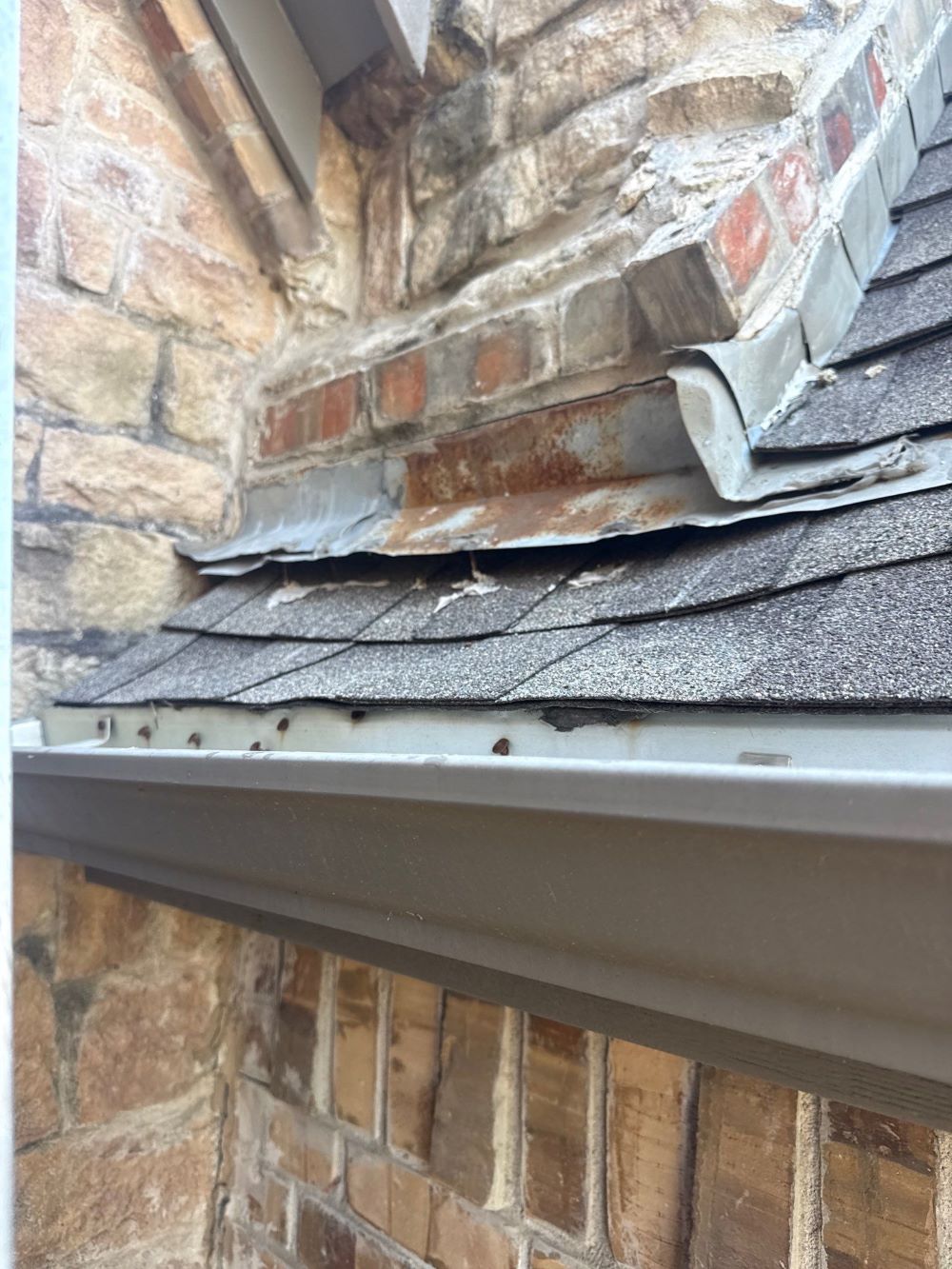 Irving residential roof - chimney flashing needs fixing