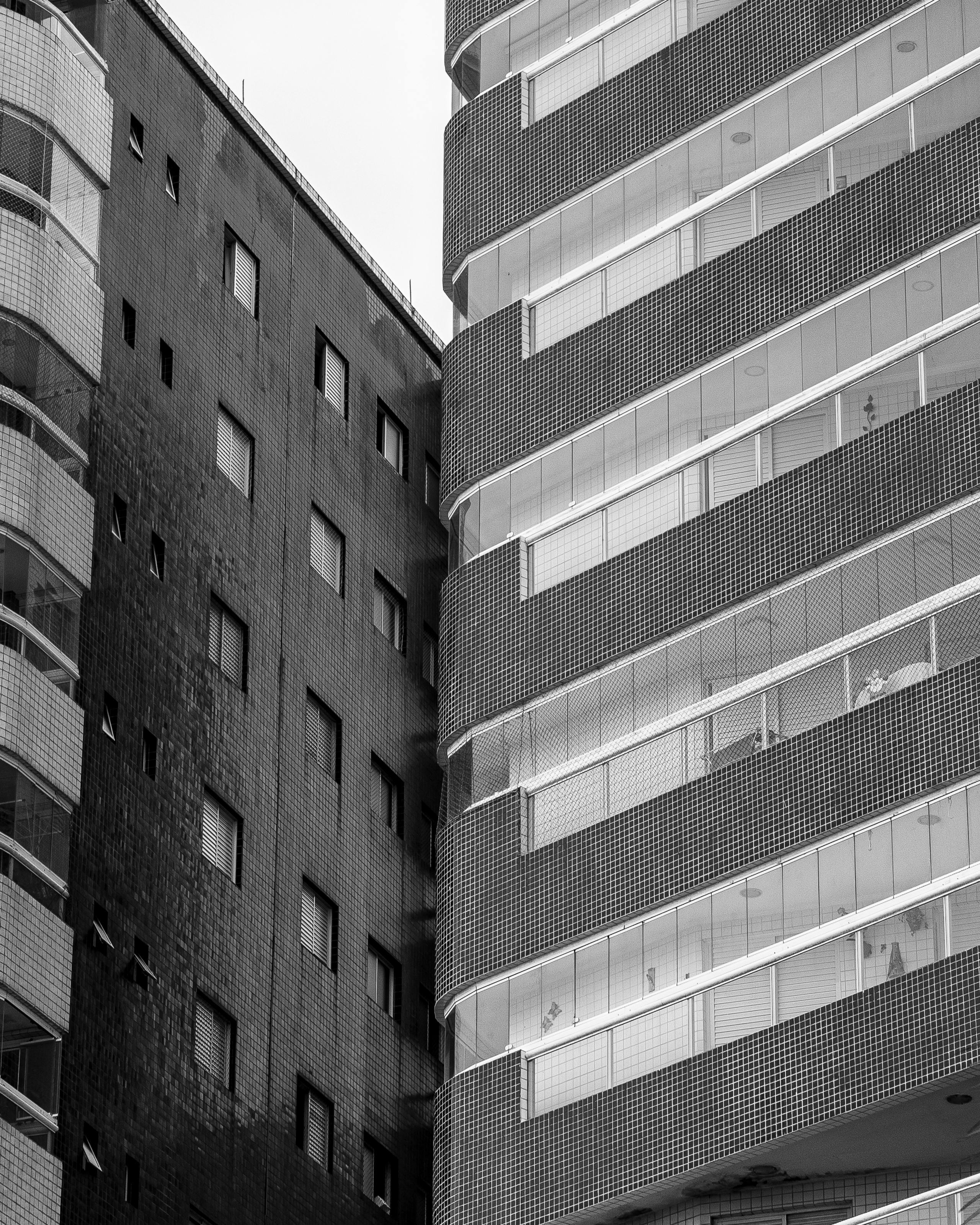 a black and white living room with a large tv