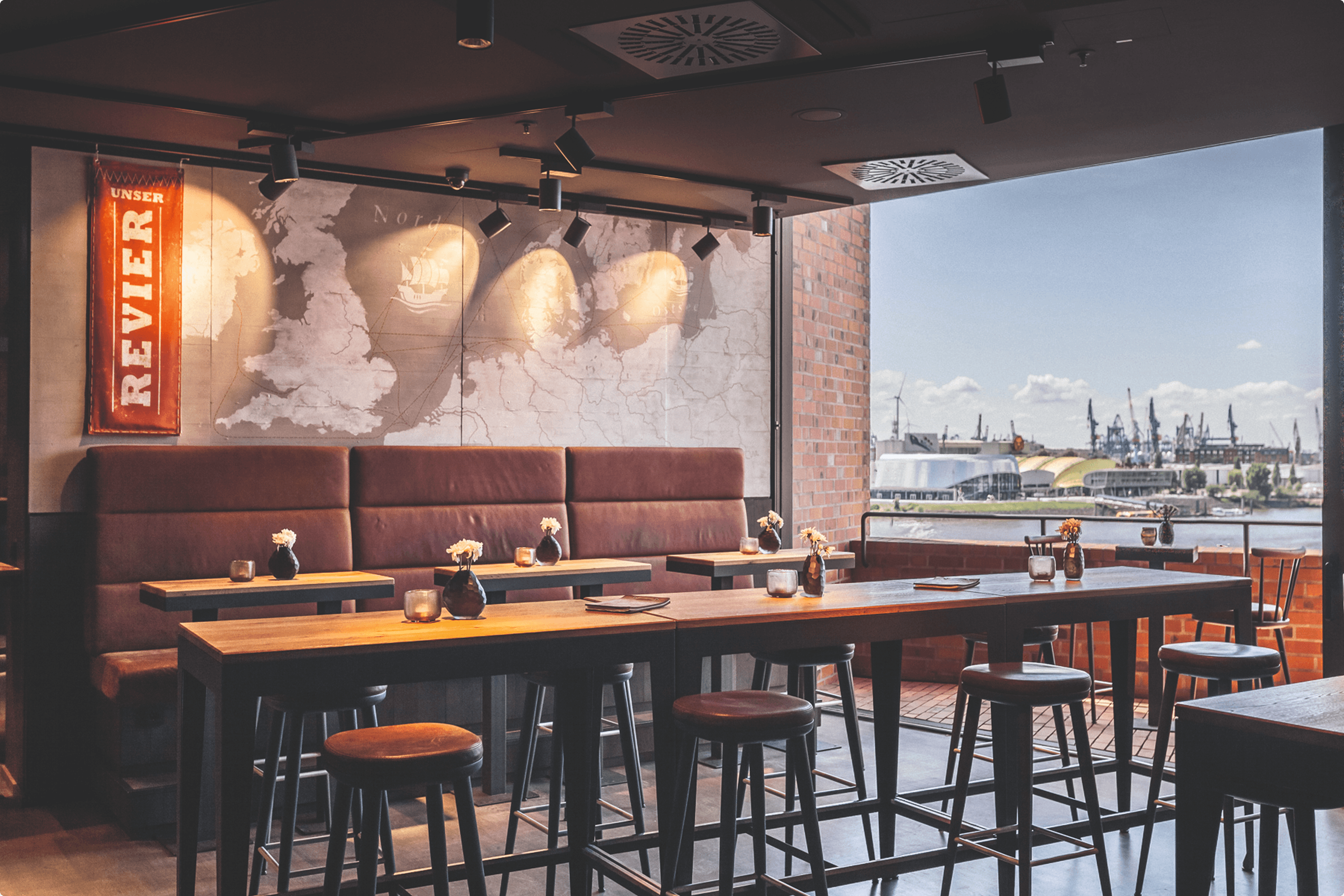 Restaurant with harbor view and world map decor