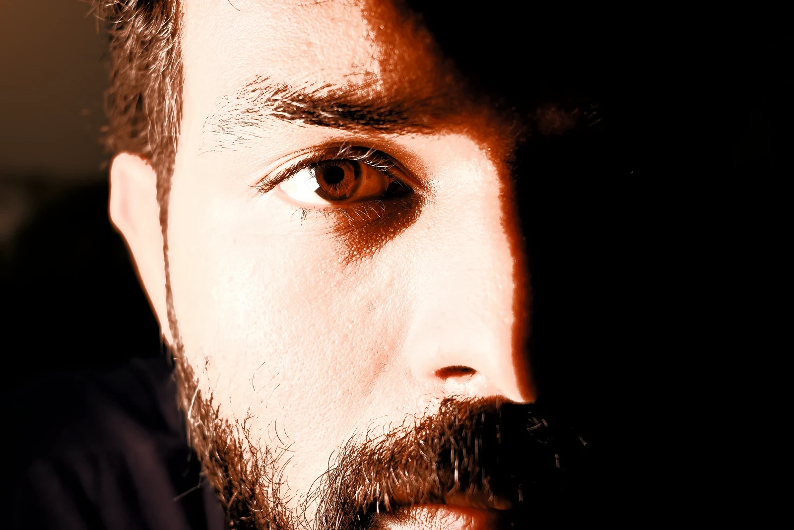 Half-lit close-up of a man's face