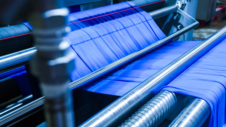 Blue fabric on rollers