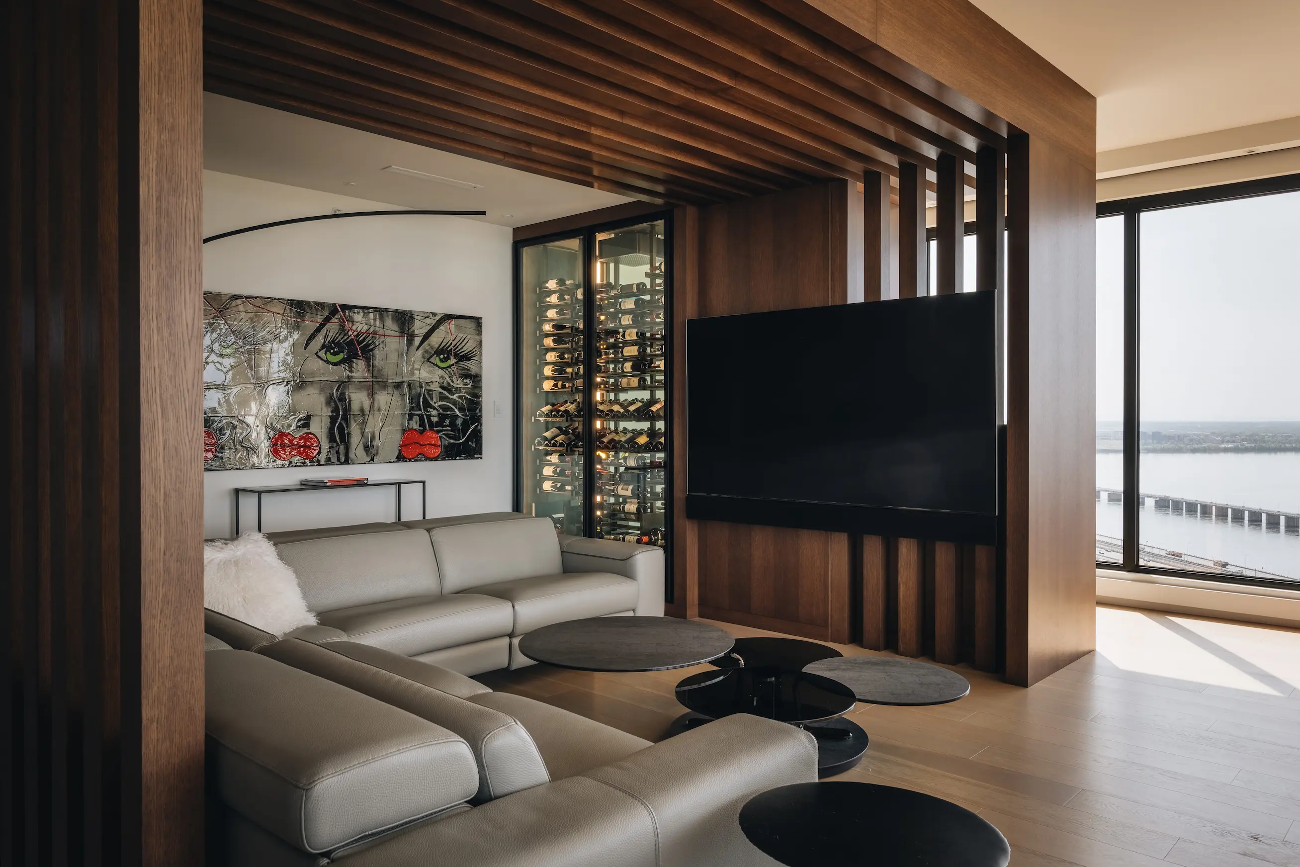 nfinity pool blending into the ocean view, minimalist sun loungers in soft neutral fabric, curved architecture