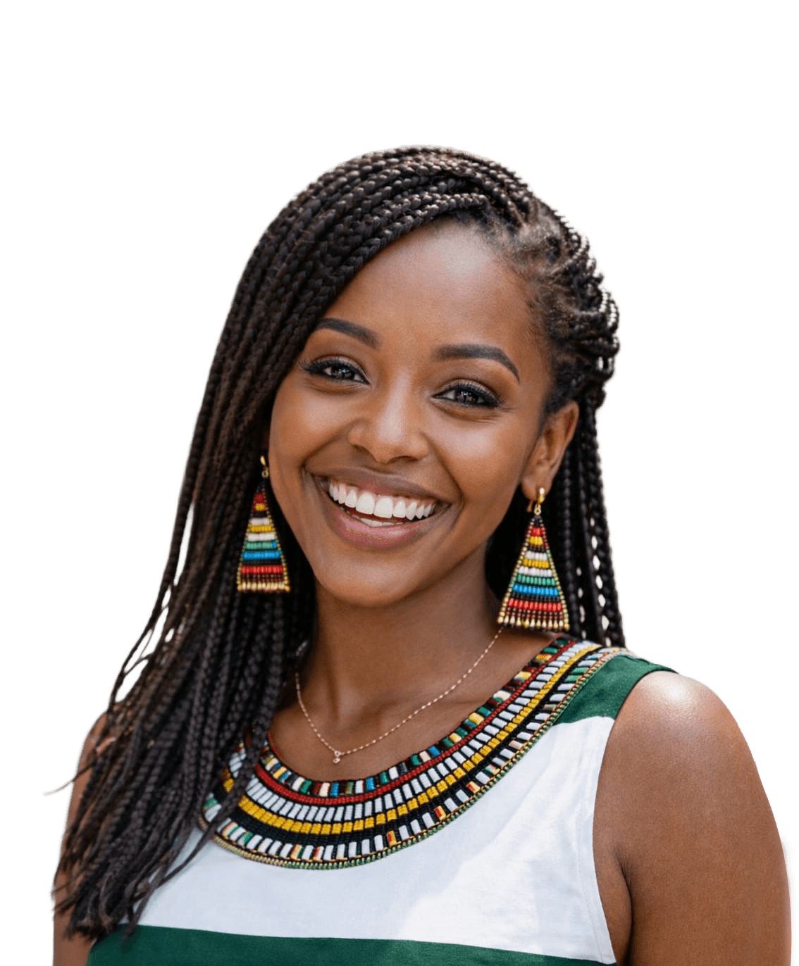 Smiling woman sitting at desk with a computer, surrounded by plants.