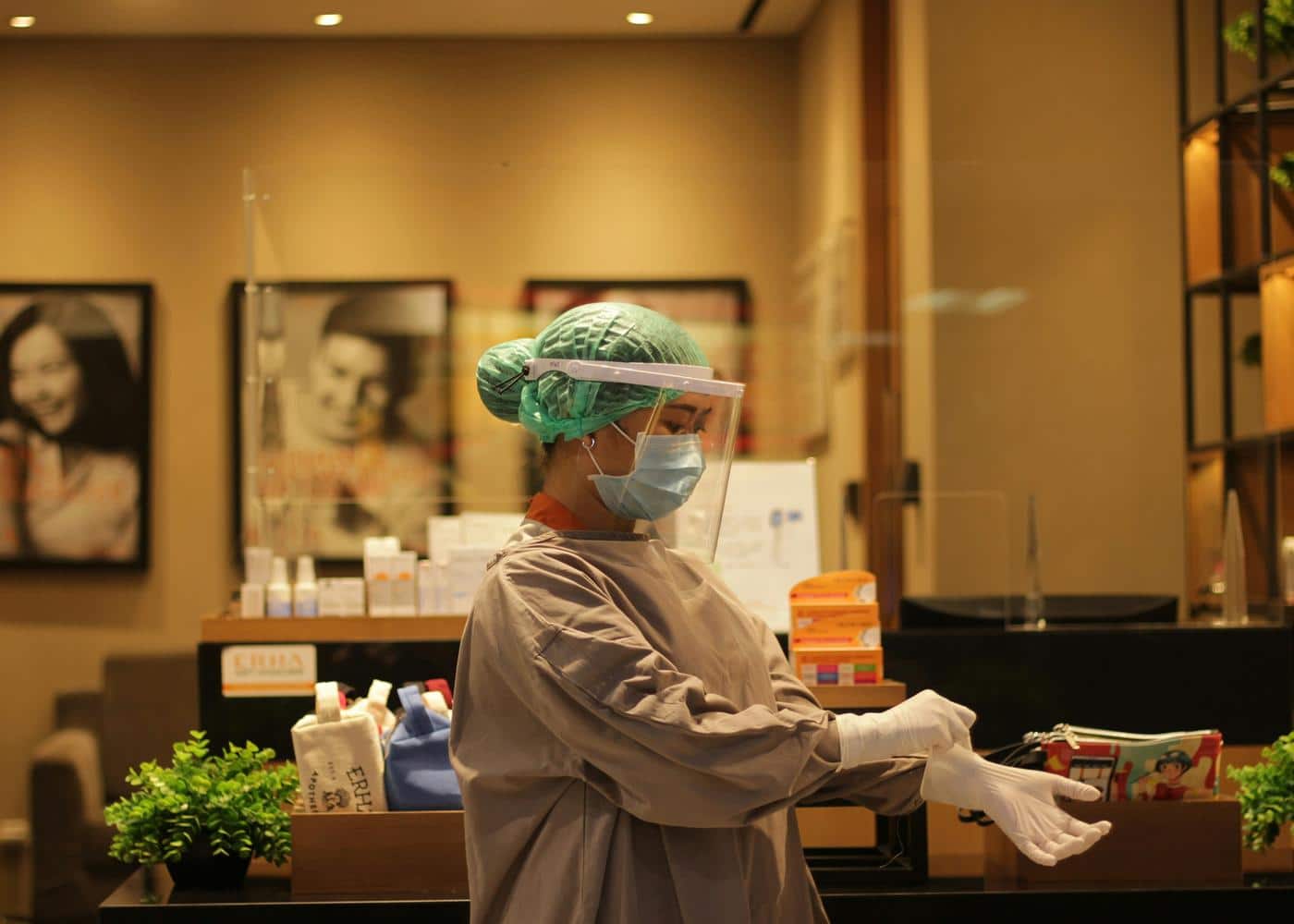 Professional red light hair loss - Dermatologist putting on gloves