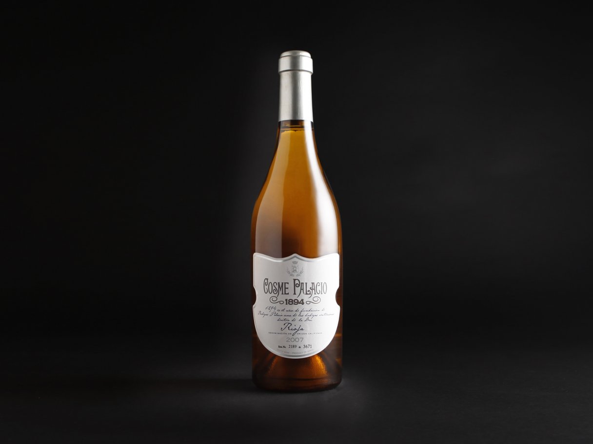 Rustic cabin in a golden field at sunset