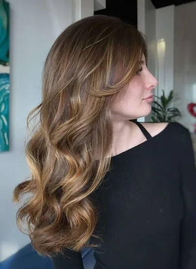 Honey Blonde with long curled hair