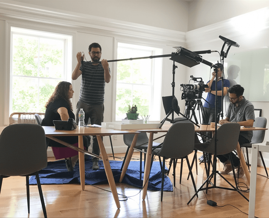 Behind the scenes shot of the camera crew and director Sergio Salgado, filming interviews with our client in Georgetown, DC.