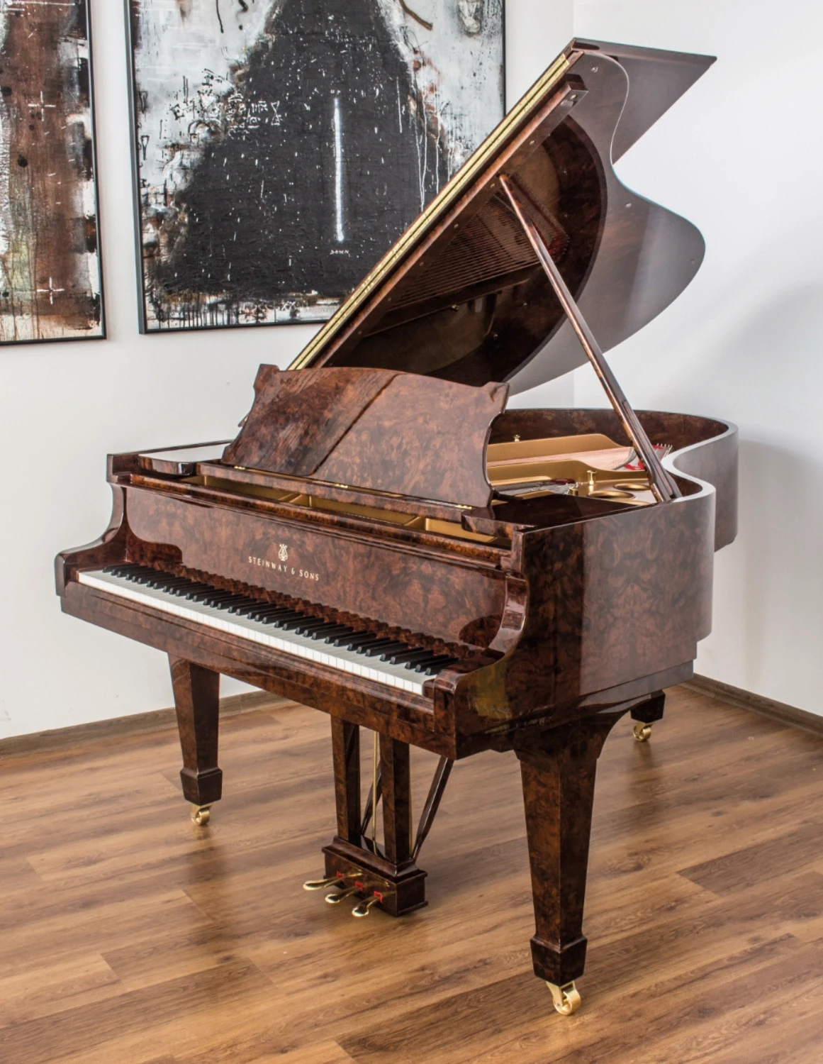 Restored Steinway & Sons grand piano with a stunning high-gloss burl wood finish, renovated by Meyer Pianos.