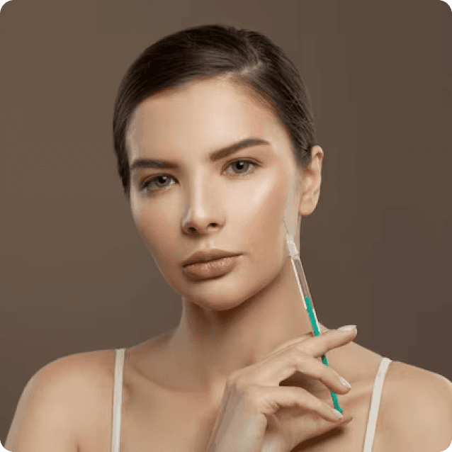 Close-up of a woman confidently holding a syringe in a clinical setting, symbolizing her readiness for a forehead and brow lift. She has a positive expression, indicating that she is an ideal candidate for the procedure. The focus is on her forehead and brow area, highlighting her decision to enhance her appearance and achieve a more youthful look.