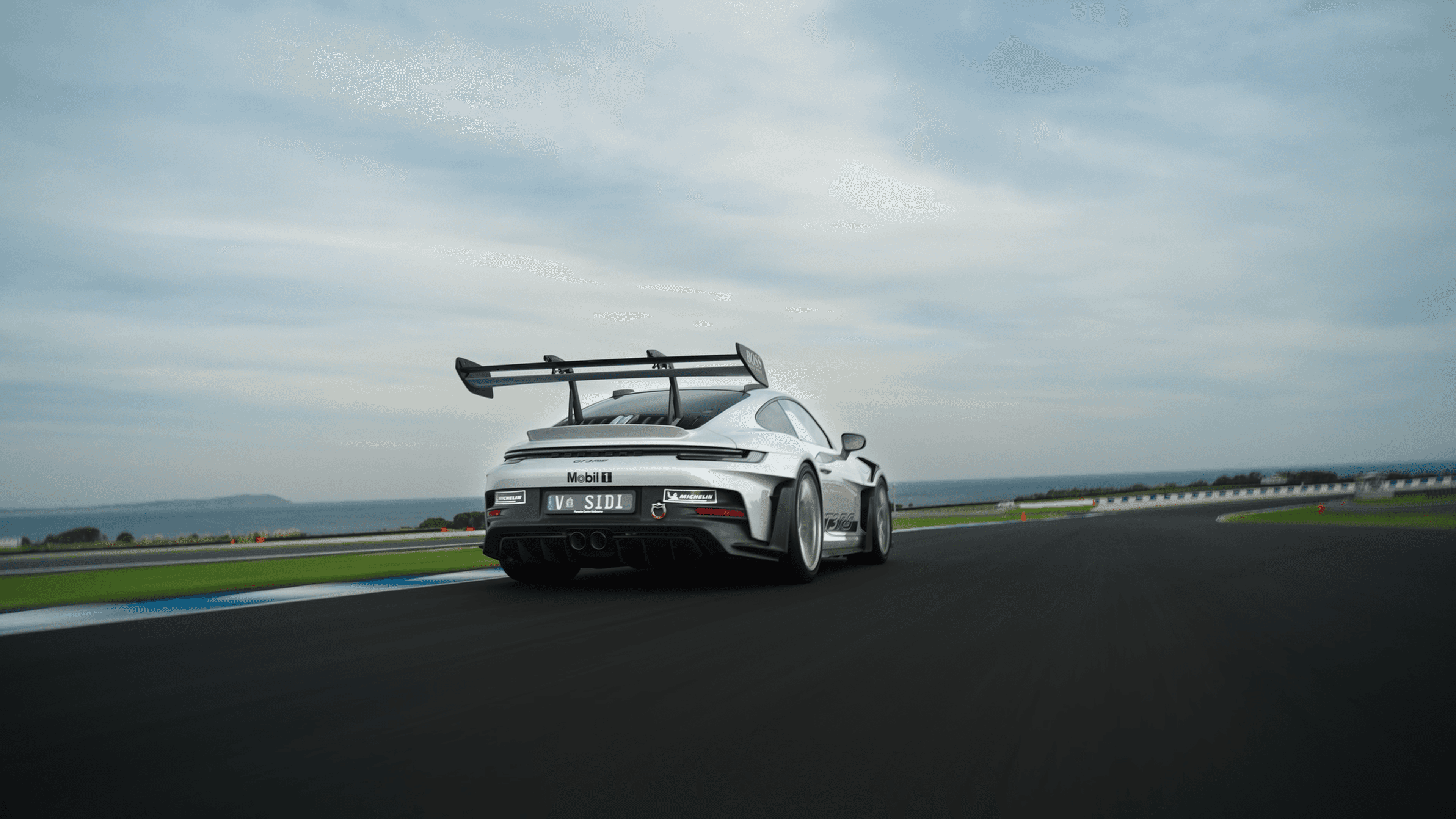 A model posing confidently on a city street, with skyscrapers and urban architecture surrounding her