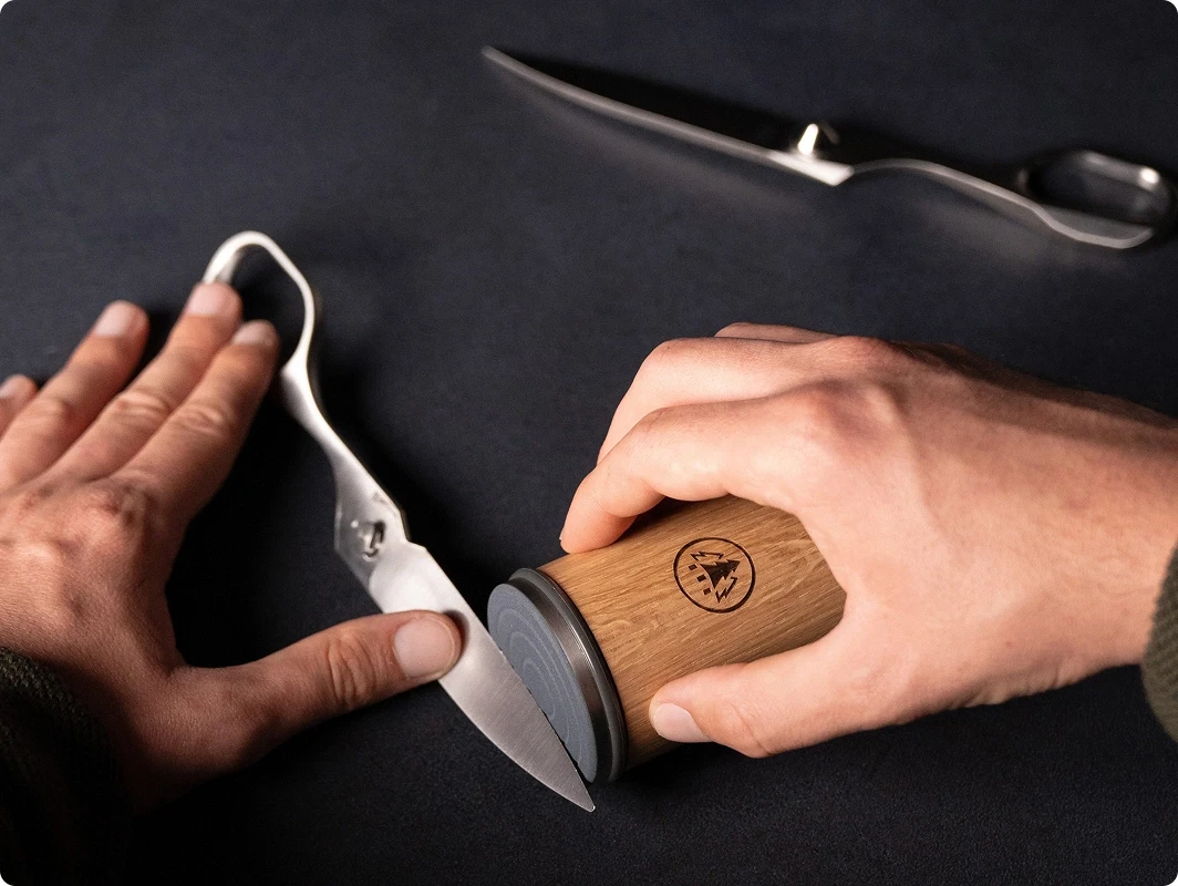 How to use the spring-loaded quick-release to separate the two scissor halves for sharpening or cleaning