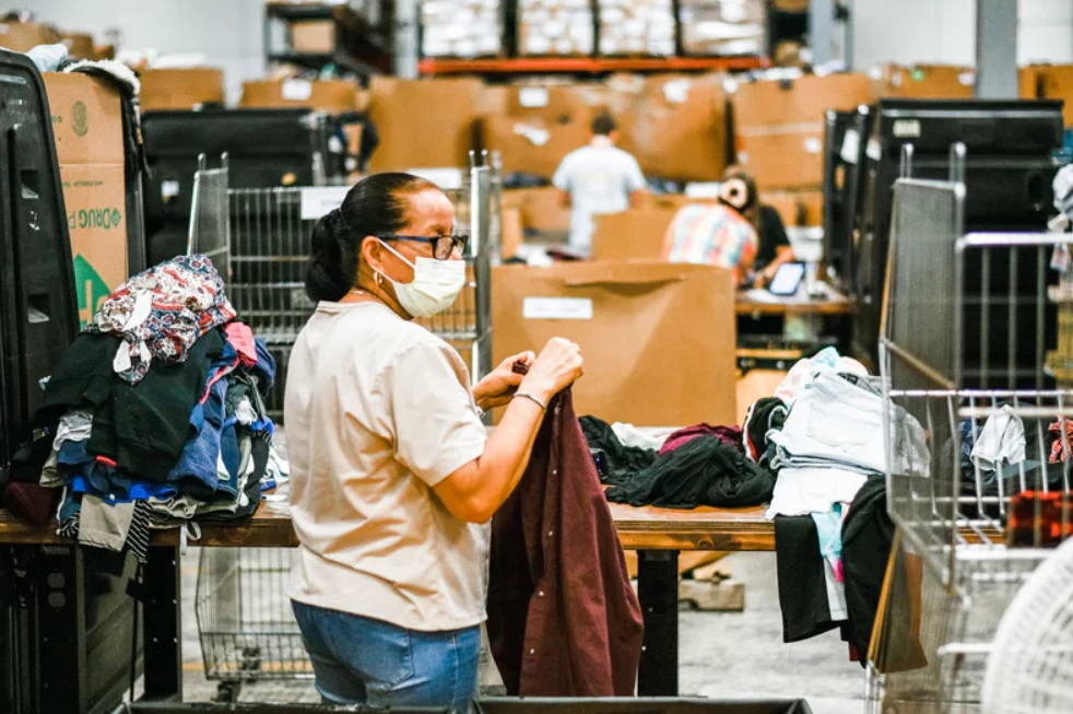 person writing on a piece of paper 