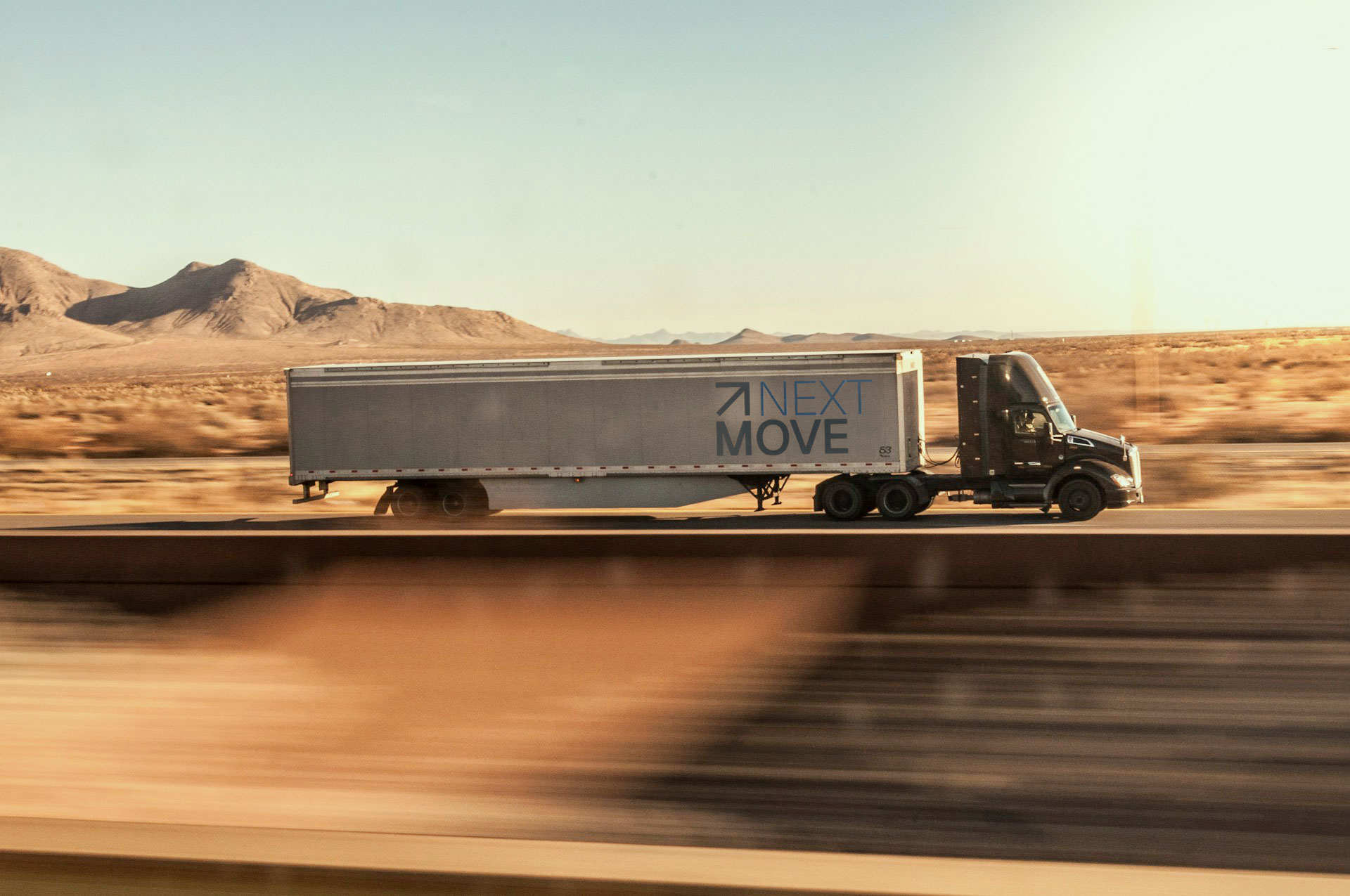 NextMove Truck on highway.