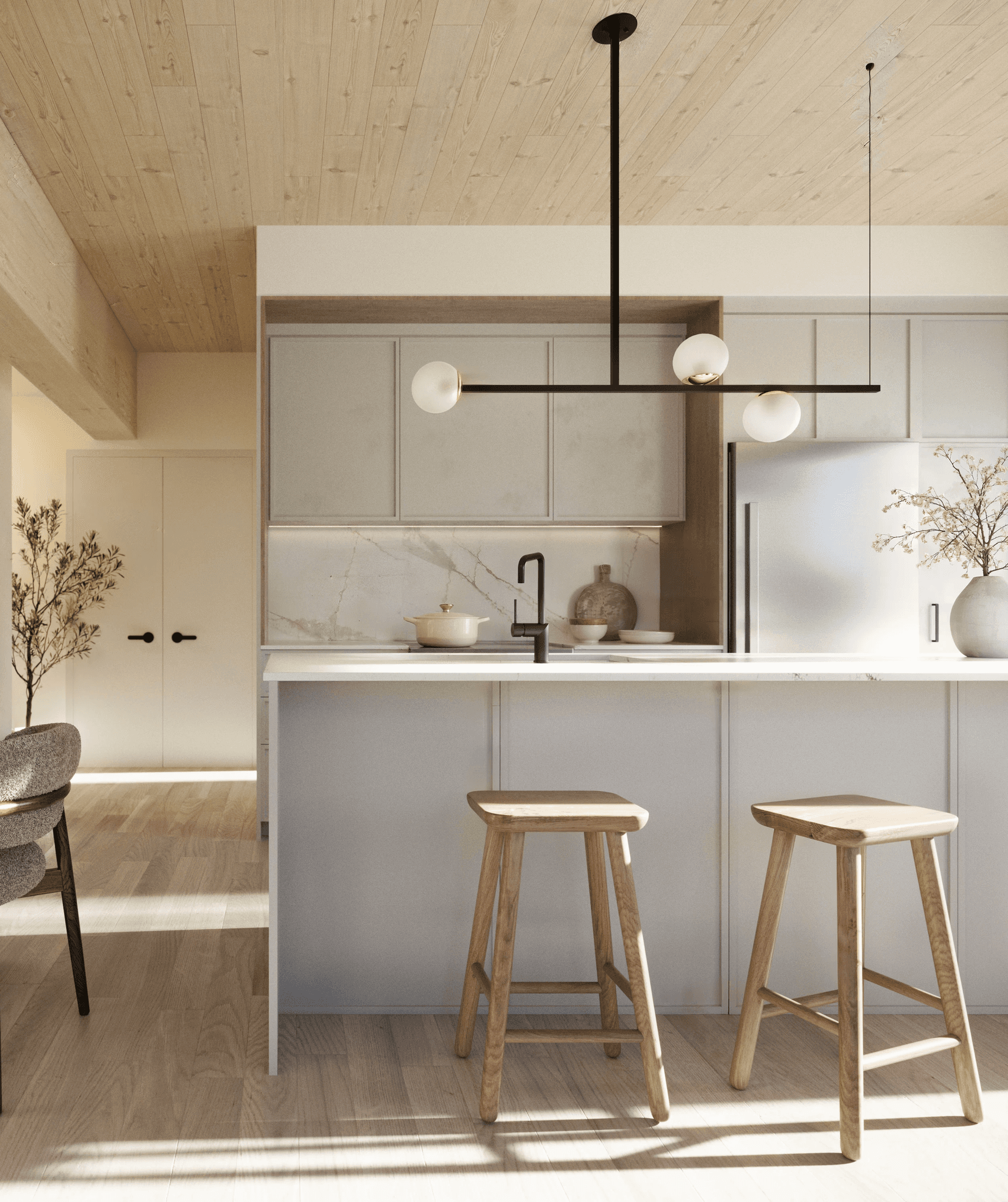 "Cuisine contemporaine avec îlot central, finitions en bois naturel et quartz – Projet locatif à Lachine.