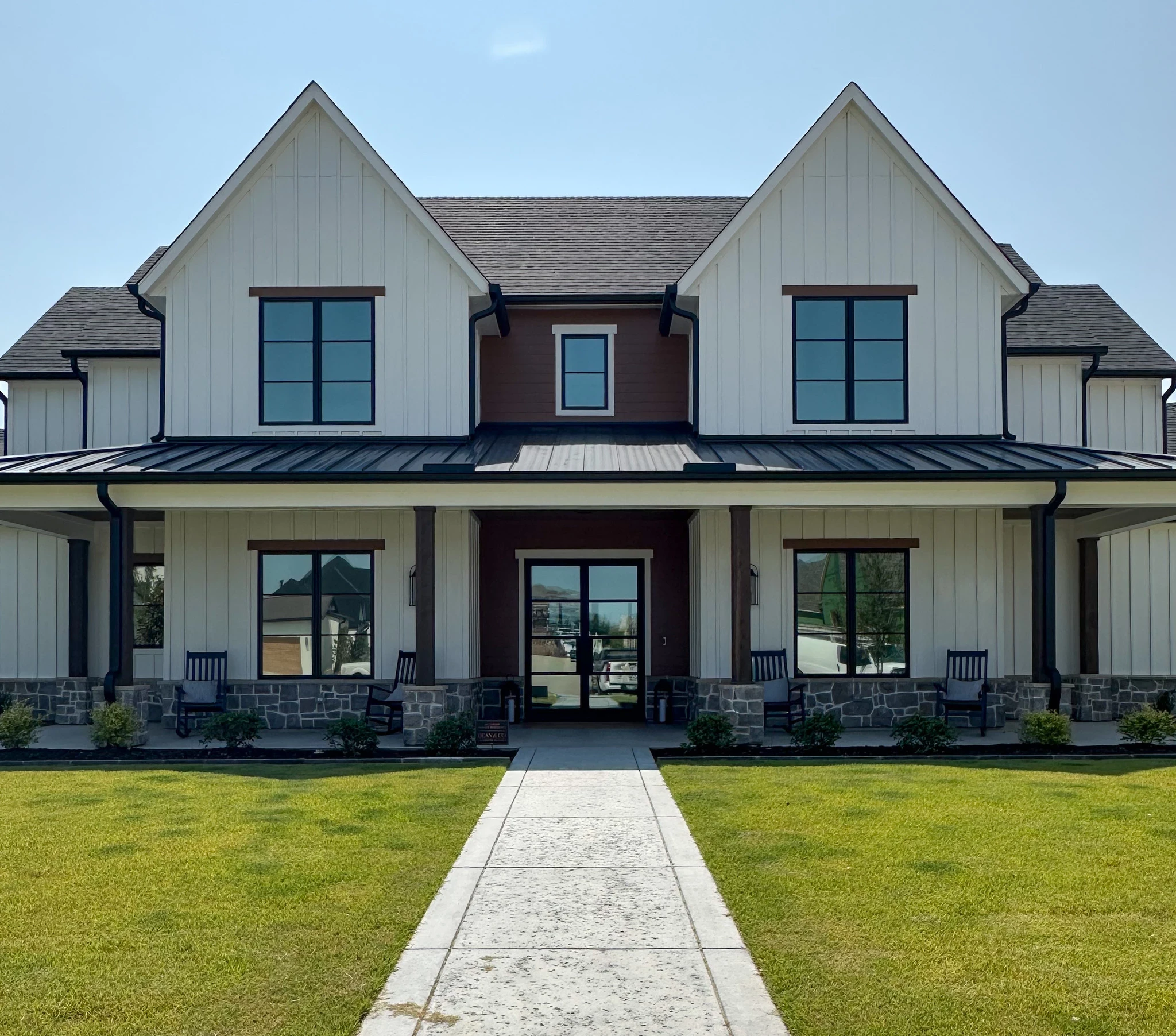 front view of a DFW Texas home with low profile iron doors by M2 Iron Doors