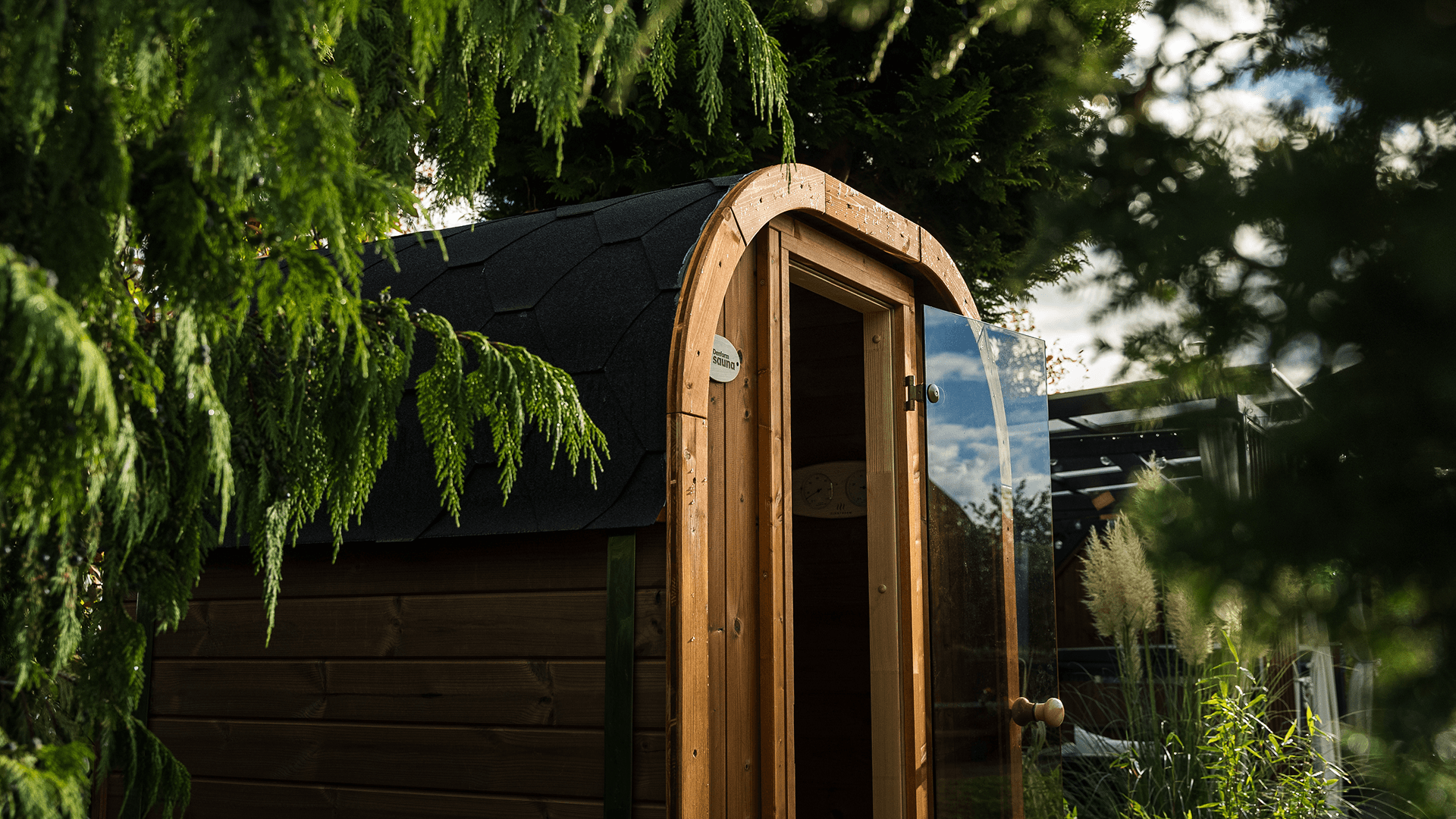 a woman in a red cape standing in the woods