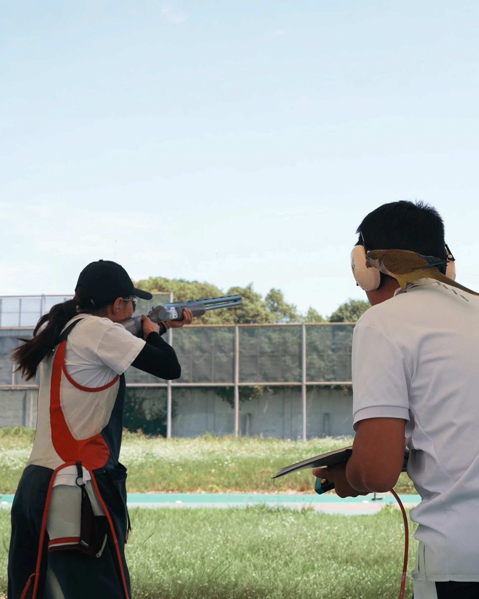 Mixed skeet team with a woman and a man athlete