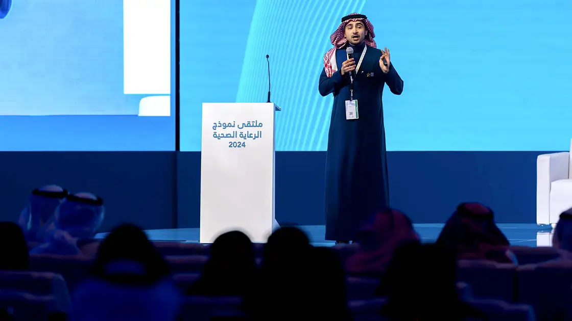 Man speaking at the stage on Event