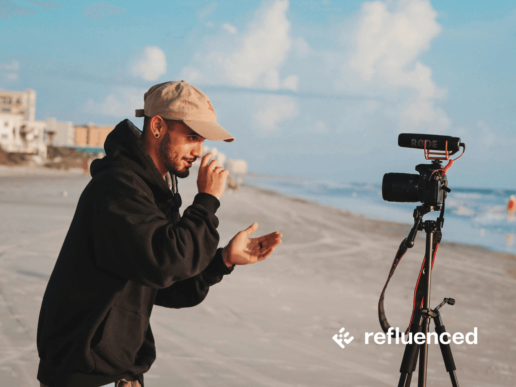 Man is filming content in front of a camera.