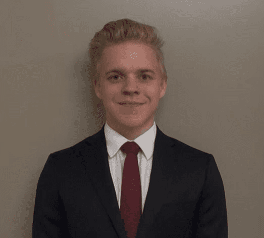 woman in gray coat singing on stage