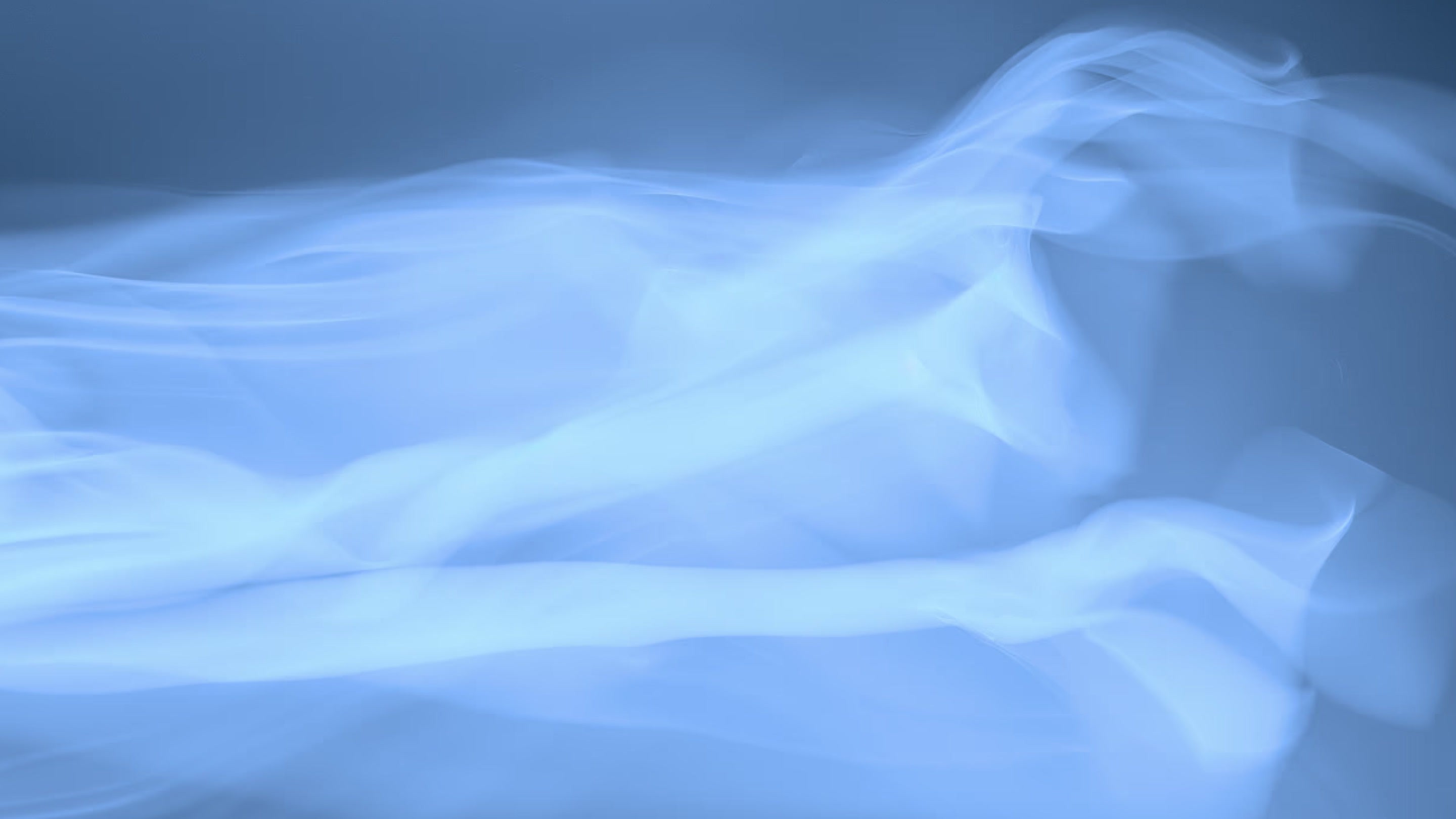 Abstract blue fluid waves symbolizing advanced medical imaging for body composition and bone density analysis in a DEXA scan.