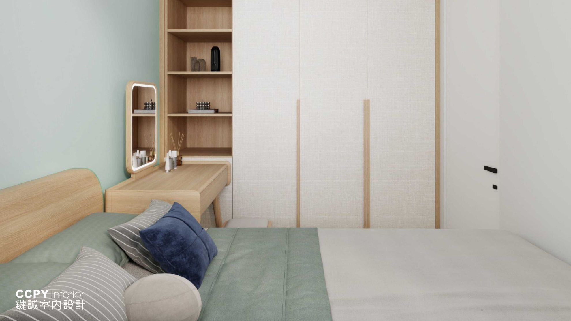 Minimalist bedroom with wooden accents and blue pillows.