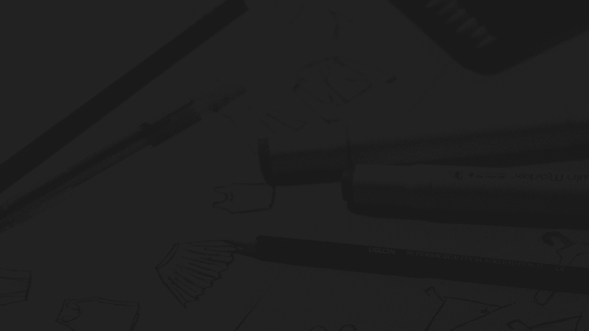 A fast black sports car races down the highway.