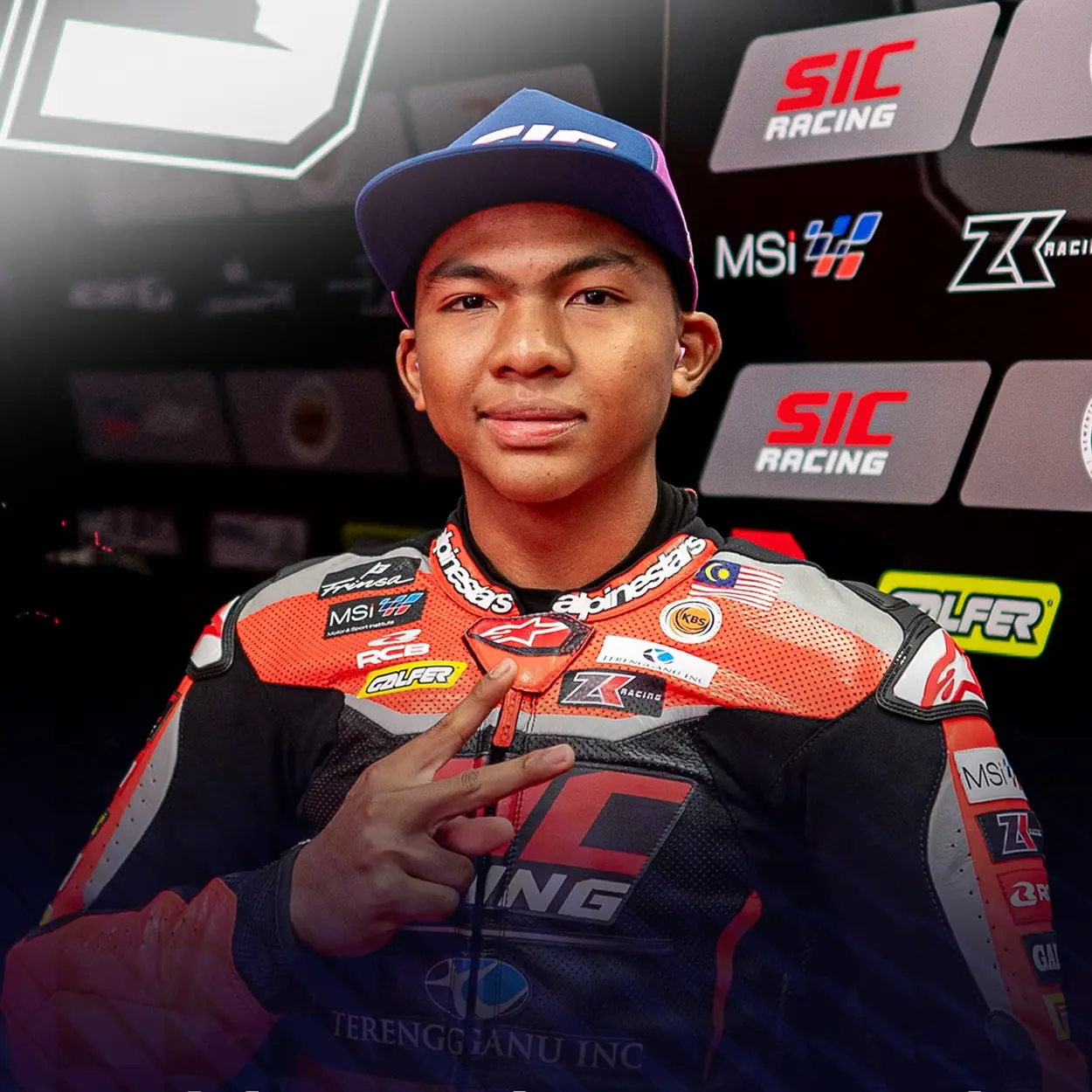 Hakim Danish posing while holding a peace sign