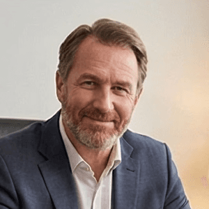 Portrait photo of a real estate professional giving a testimonial about Vistare’s AI-powered visuals