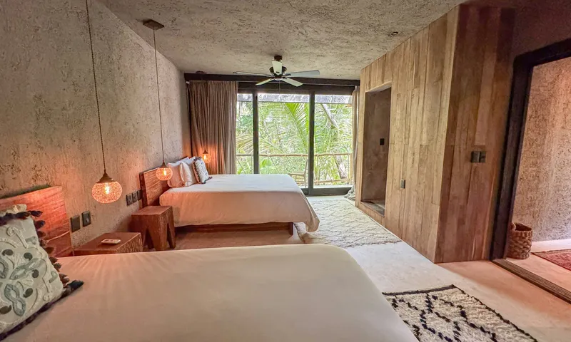 Two Bedroom Villa With Pool, huge window with jungle view at Nômade Tulum.