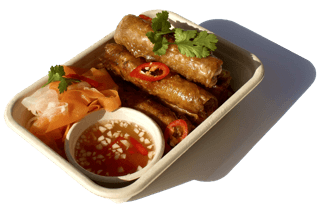 Crispy Vietnamese spring rolls (Gio Chả) served fresh with herbs – popular Asian street food in Auckland.