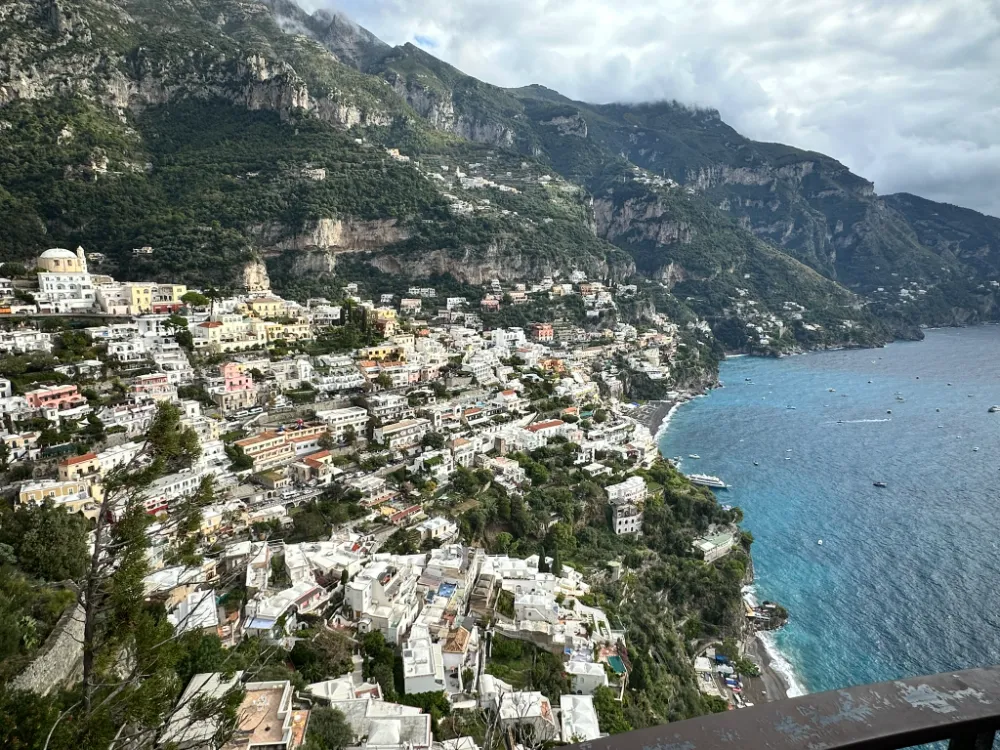 Positano's pastel houses cascading down the cliffside above the sea.