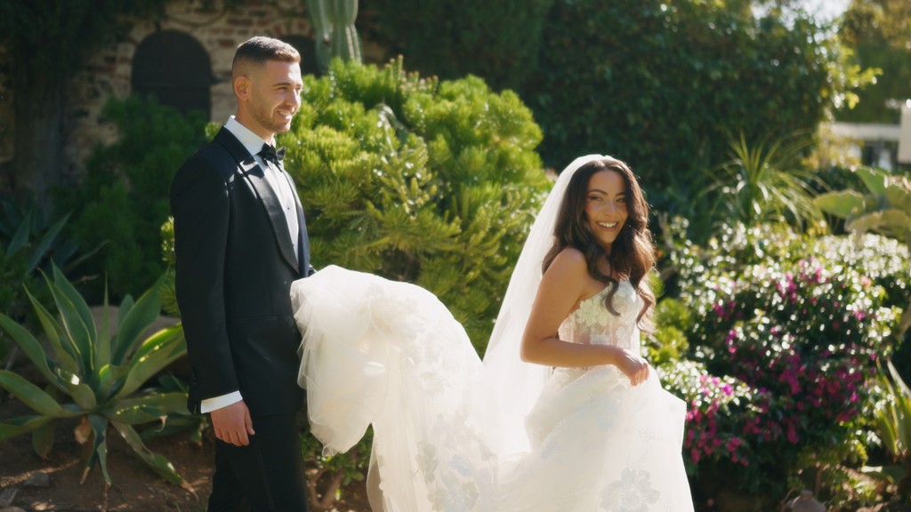 couple under lighted tree during night time