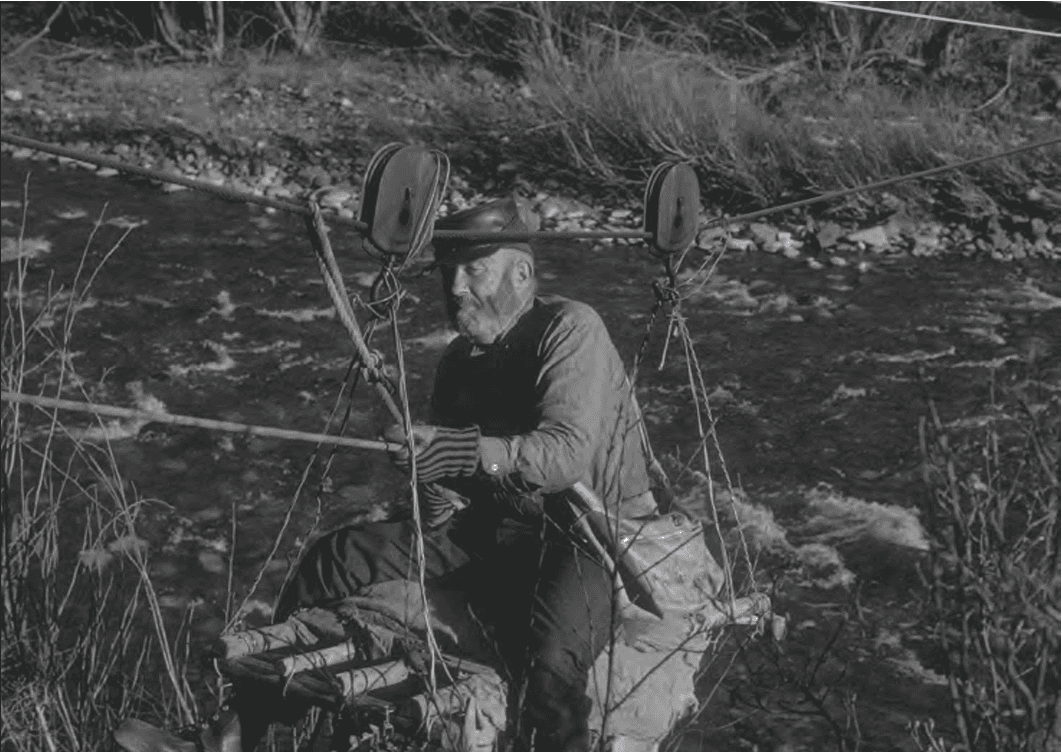 Photo of John Vines crossing Big Creek around 1967